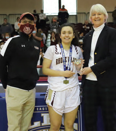 MVP: Antonia Corsinetti accepts the Little
East Conference tournament MVP award
last Saturday afternoon after the team beat
UMass-Dartmouth.
